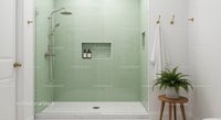 Modern bathroom shower with green tiled walls and plant