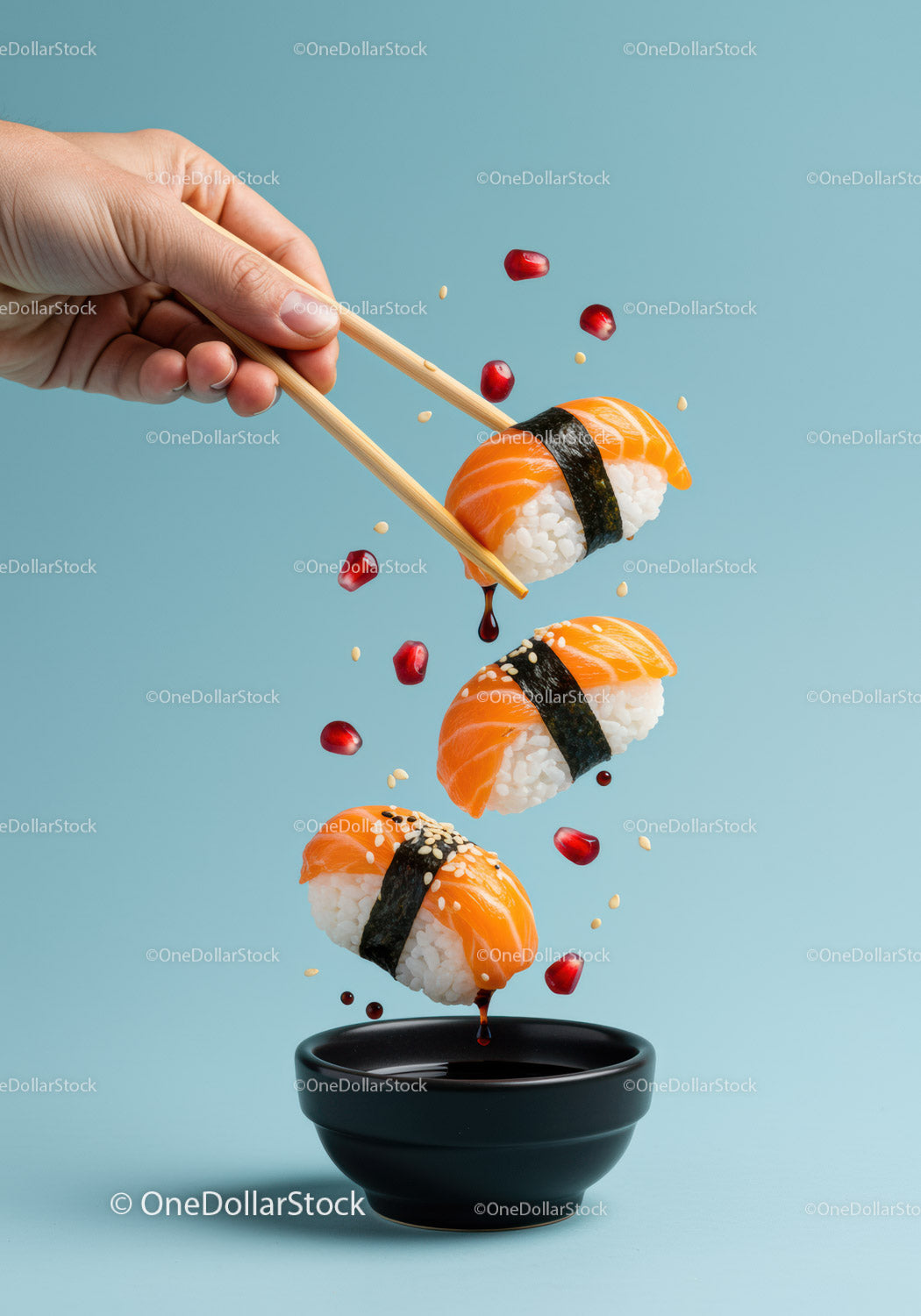 Fresh salmon sushi dipping in soy sauce with chopsticks