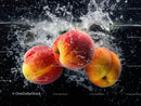 Fresh Ripe Apples Splashing into Water in Vibrant Scene