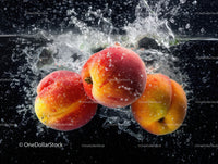 Fresh Ripe Apples Splashing into Water in Vibrant Scene