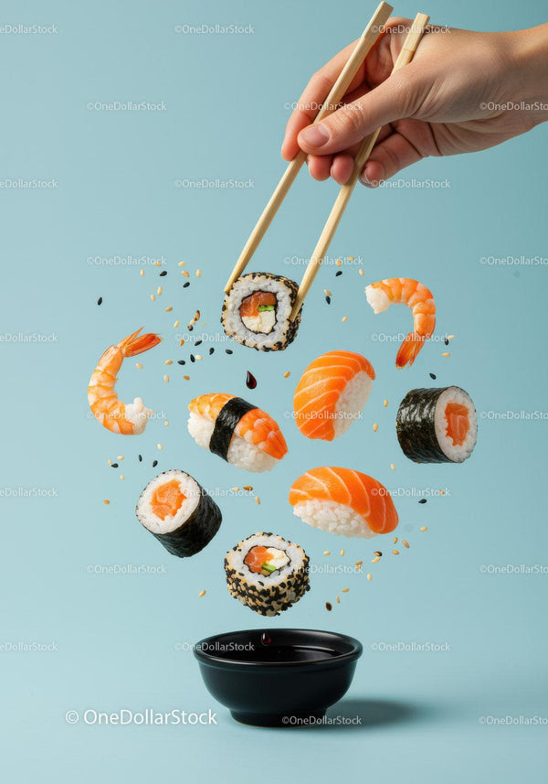 Fresh sushi pieces floating above soy sauce bowl