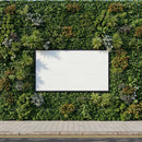 Blank billboard surrounded by lush green foliage outdoors