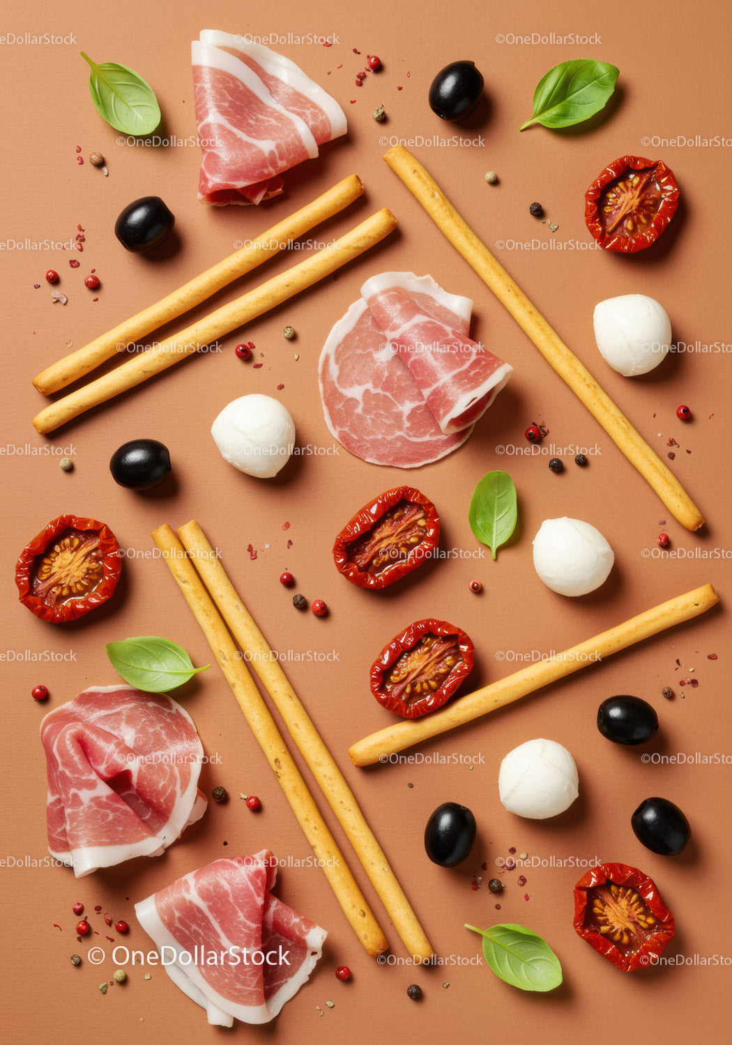 Italian antipasto arrangement with cured meats and snacks
