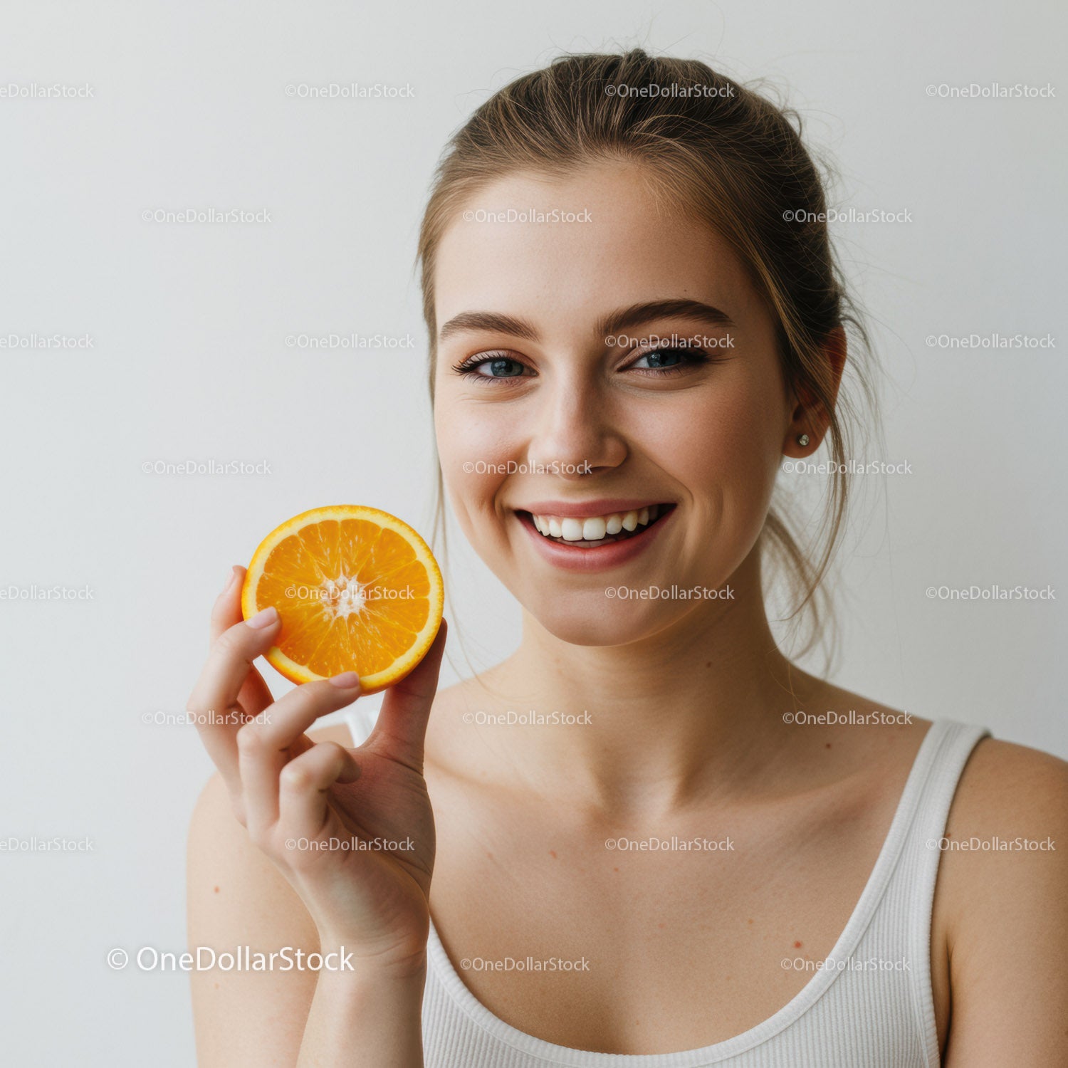 Bright Smiling Woman with Orange Slice for Healthy Lifestyle and Summer Vibe