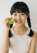 Happy Girl Holding Green Grape Cluster and Smiling Portrait