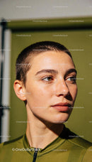 Focused athlete with short hair in green sportswear