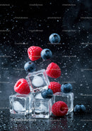 Fresh raspberries and blueberries with ice cubes splash