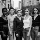 Diverse women standing confidently in urban setting