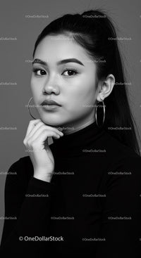 Elegant Black and White Portrait of an Asian Woman with Hoop Earrings