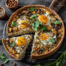 Seafood Shrimp Quiche with Fresh Herbs on Rustic Wooden Table