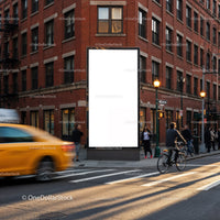 Urban street scene with blank billboard and traffic