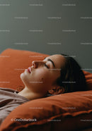 Relaxed Woman Resting on Soft Pillow in Cozy Bedroom Scene