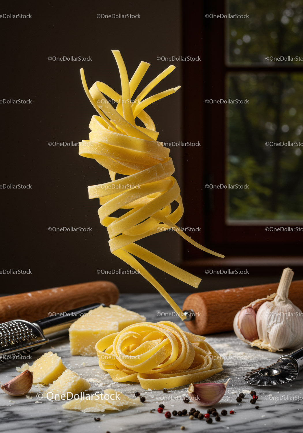 Fresh pasta noodle nest with cheese and garlic cloves