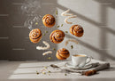 Steaming coffee with floating cinnamon rolls and spices
