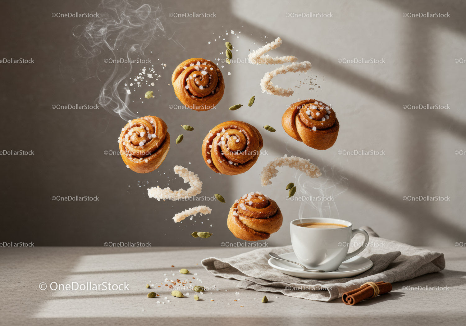 Steaming coffee with floating cinnamon rolls and spices