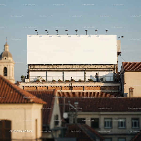 Urban rooftop terrace with large blank billboard in daylight JPG Mockup Image