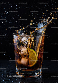 Refreshing Cola Splash with Ice and Lime Slice