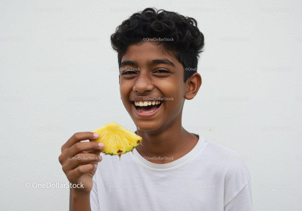 Juicy Pineapple and a Joyful Boy Smiling Brightly in White T-Shirt