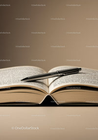 Open Book with Fountain Pen on Desk in Modern Workspace