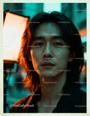 Young man with long hair illuminated by studio lighting