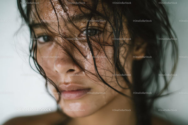 Close-Up of Woman with Wet Hair and Intense Gaze