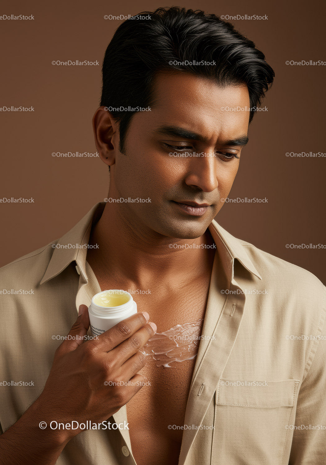 Elegant Male Portrait Showing Skin Care Routine with Lotion