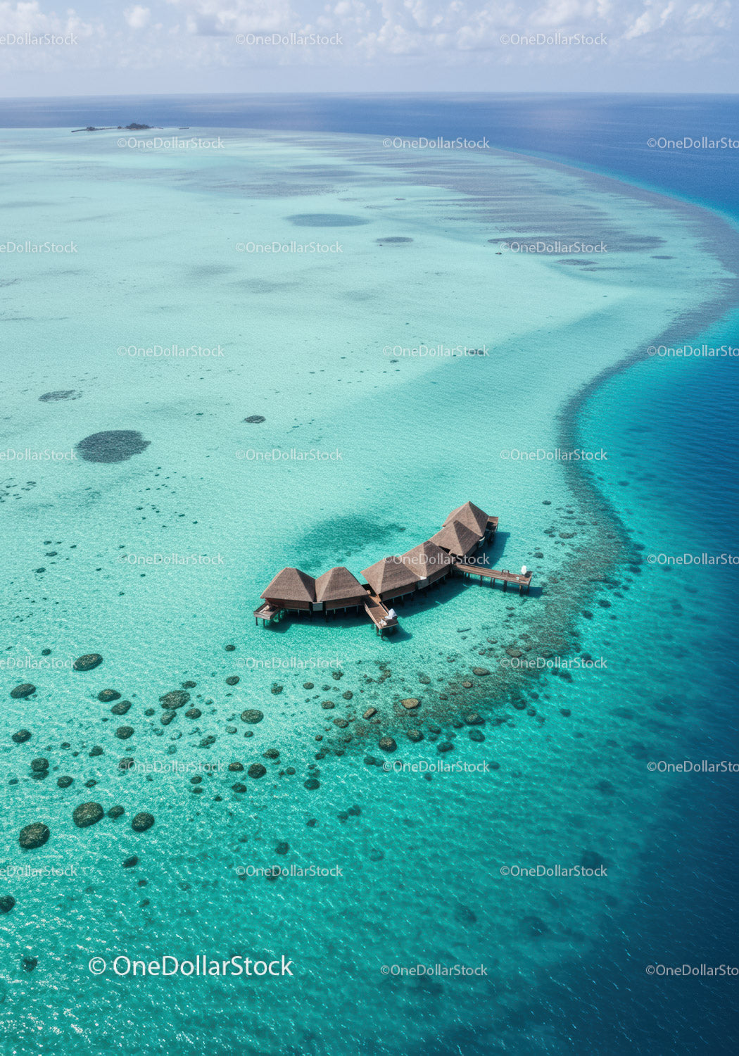 Overwater Bungalows Surrounded by Clear Turquoise Ocean in Tropical Paradise