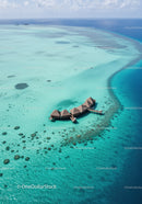 Overwater Bungalows Surrounded by Clear Turquoise Ocean in Tropical Paradise