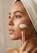 Close-up of a Woman Using a Jade Roller for Skin Rejuvenation with Creamy Face Mask