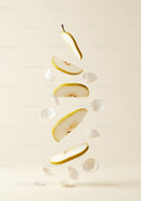 Floating sliced pear with delicate white petals