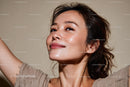 Portrait of a Smiling Woman with Radiant Skin and Joyful Expression