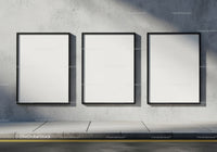 Three Blank Vertical Posters on Urban Concrete Wall