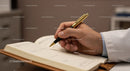 Professional Person Writing in Leather Journal with Gold Pen