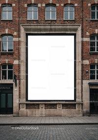 Blank billboard on vintage brick building facade