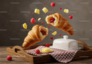 Crispy croissants filled with raspberry jam and butter