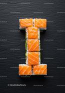 Fresh salmon sushi rolls arranged in a T shape