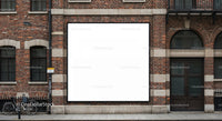 Blank billboard on urban brick building facade