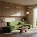Modern living room with green sofa and natural light