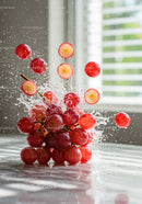 Fresh red grapes bursting with water droplets