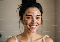 Young woman with facial mask demonstrating skincare routine