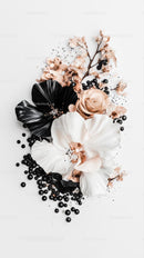 Elegant Floral Arrangement with Black and White Silk Leaves and Soft Pink Blooms
