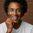 Close-up of Smiling African American Man with Natural Hair in Studio