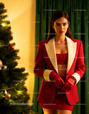 Stylish woman in festive red outfit near Christmas tree