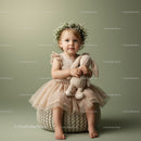 Toddler Girl in Floral Crown Holding Plush Bunny