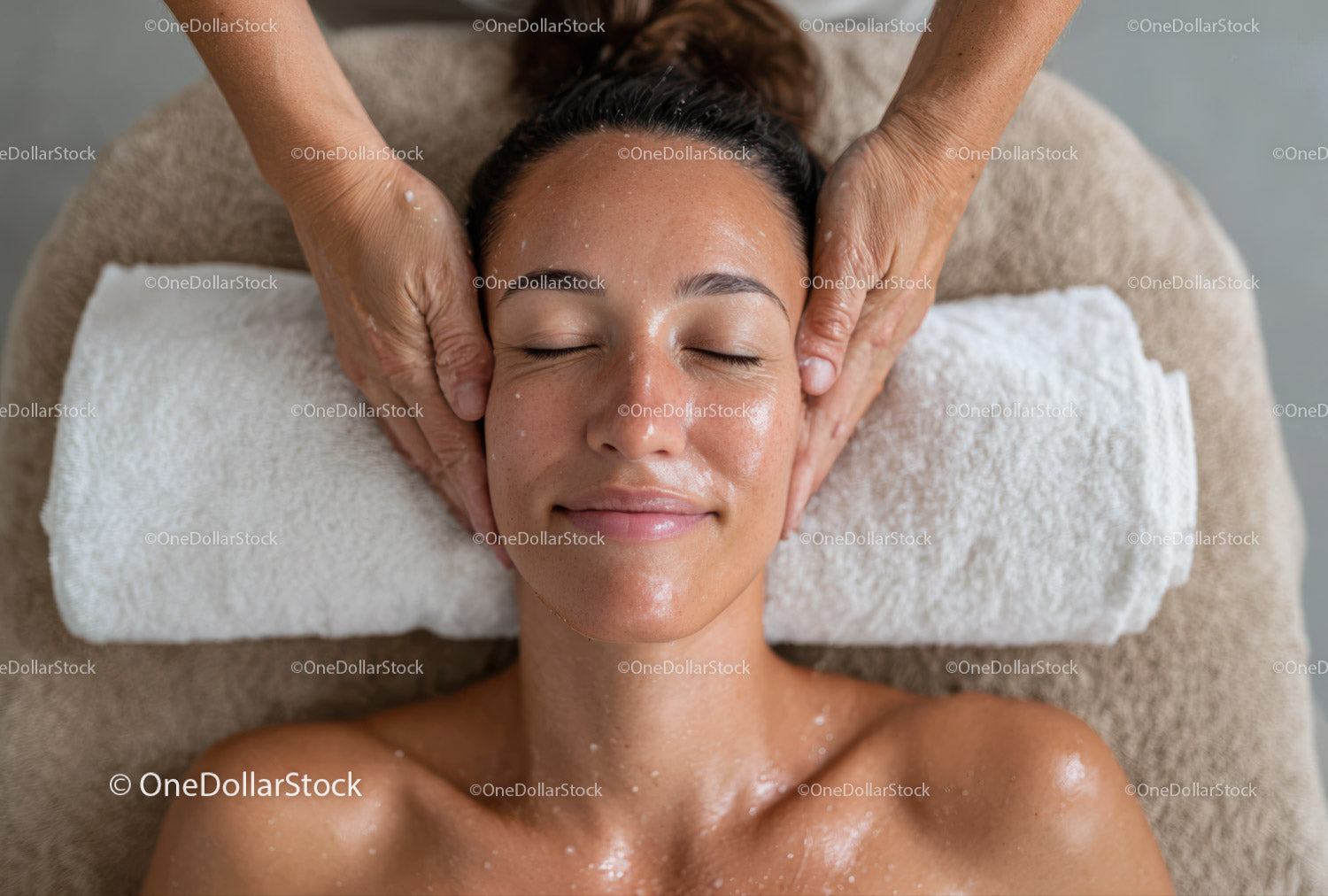 Woman Relaxing During Facial Massage in Spa Environment