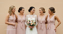 Bride and Bridesmaids Smiling Together at a Joyful Wedding