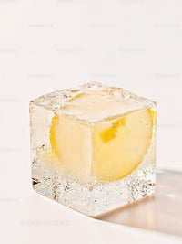 Close-up of Ice Cube with Lemon Slice Inside