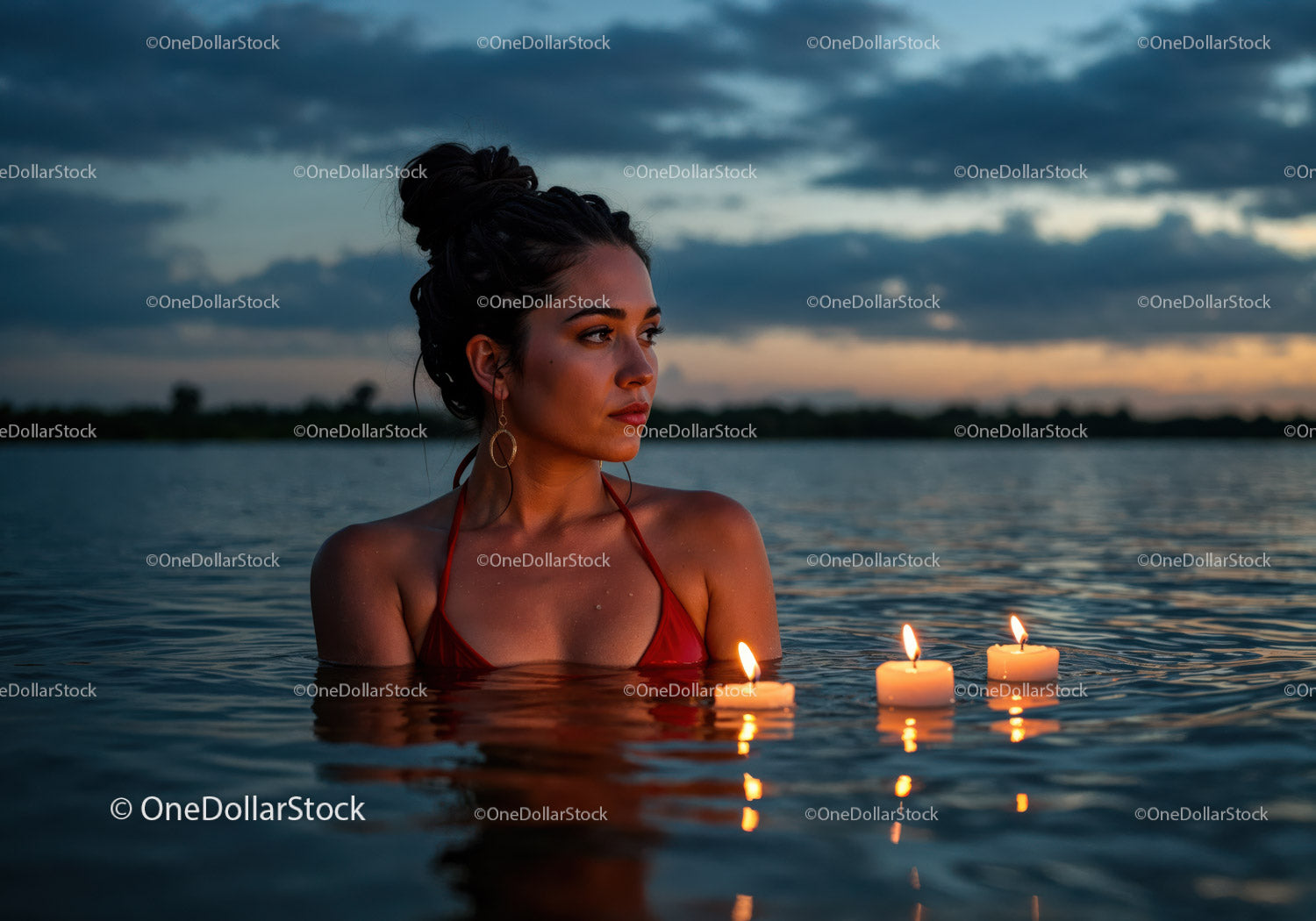Woman in Black Bikini with Candles Floating in Lake at Sunset