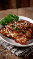 Crispy Baked Chicken Thigh with Parsley Garnish on Rustic Wooden Table