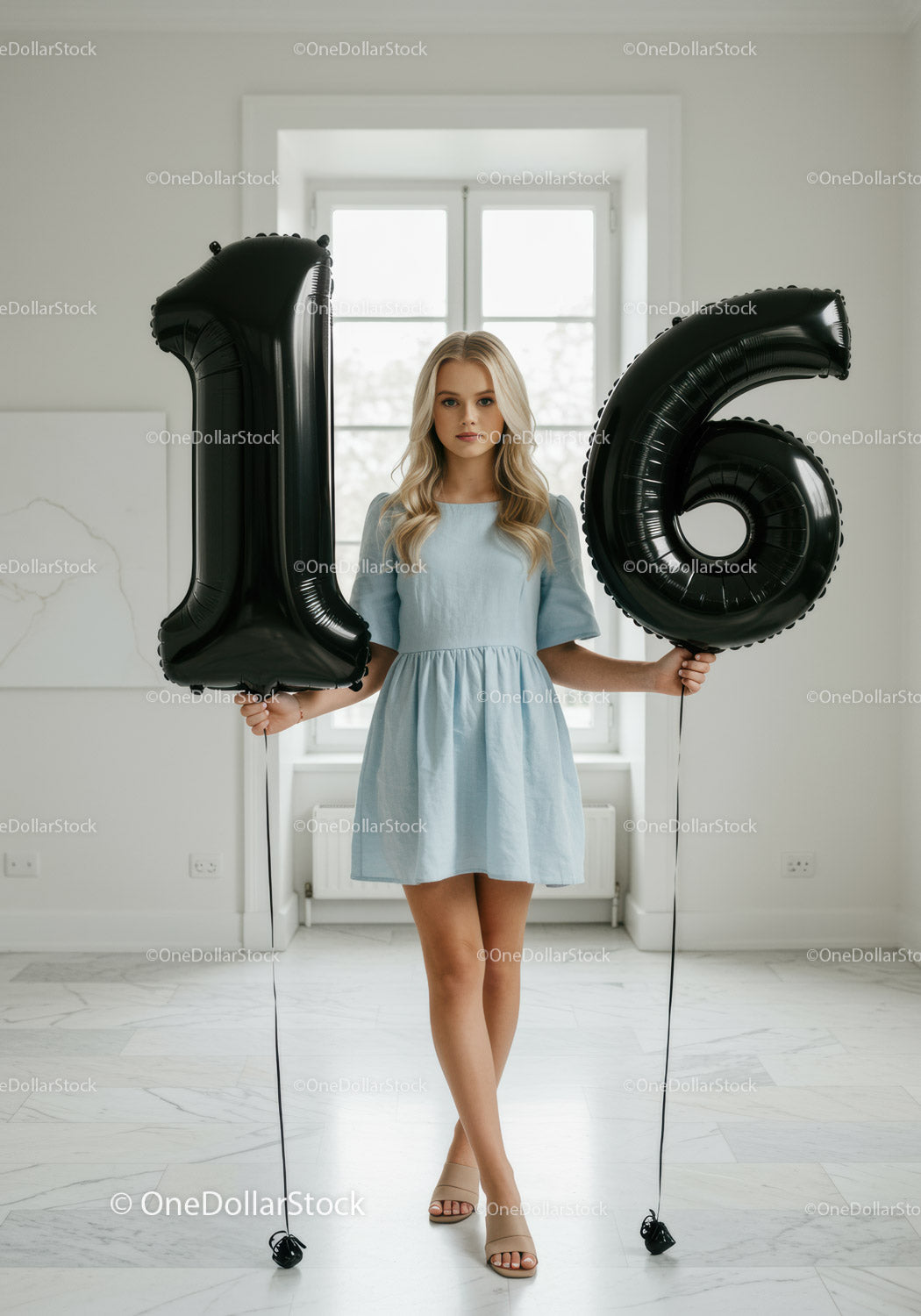 Teenage girl celebrating 16th birthday with balloons